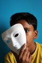 Boy removing the mask Royalty Free Stock Photo