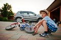 Boy repair bike. Little mechanic work with bicycle Royalty Free Stock Photo