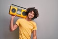 Boy retro music lover on isolated gray background