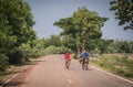 A boy rides a bicycle around an island in the middle of Pa Kham Chanot