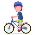 Boy rides a bicycle in a protective helmet Royalty Free Stock Photo