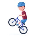 Boy rides a bmx bike on the rear wheel Royalty Free Stock Photo