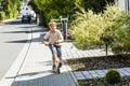 Boy rides his scooter Royalty Free Stock Photo