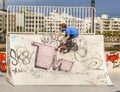 Boy rides his scooter at the skate park Royalty Free Stock Photo