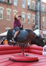 Boy Rides Mechanical Bull at Mexican Street Festival in Chicago