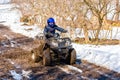 The boy is riding an ATV off-road Royalty Free Stock Photo