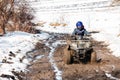 The boy is riding an ATV off-road Royalty Free Stock Photo