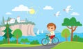 Boy riding a bicycle. Summer mediterranean background