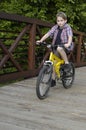 Boy riding bike on bridge Royalty Free Stock Photo