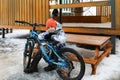 Boy riding a bike during winter holidays Royalty Free Stock Photo