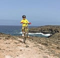 Boy riding his mountain bike offroads with wheely Royalty Free Stock Photo