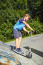 Boy riding his scooter Royalty Free Stock Photo