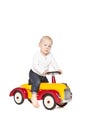 Boy riding his toycar Royalty Free Stock Photo