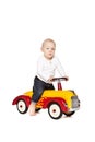 Boy riding his toycar Royalty Free Stock Photo