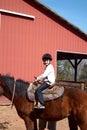 Boy riding horse Royalty Free Stock Photo