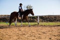 Boy riding a horse in the ranch Royalty Free Stock Photo