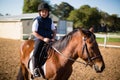 Boy riding a horse in the ranch Royalty Free Stock Photo