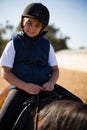 Boy riding a horse in the ranch Royalty Free Stock Photo