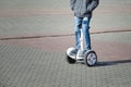 Boy riding a hoverboard in the square