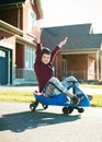 Boy riding scooter Royalty Free Stock Photo