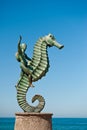 Boy riding seahorse statue Royalty Free Stock Photo