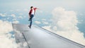 Boy riding skateboard on wing Royalty Free Stock Photo