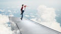 Boy riding skateboard on wing Royalty Free Stock Photo