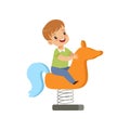 Boy riding spring horse see saw, kid having fun on playground vector Illustration on a white background Royalty Free Stock Photo