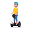 Boy riding a standing modern electric gyro scooter Royalty Free Stock Photo