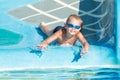 The boy is riding a water slide. Royalty Free Stock Photo