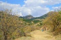 The boy is on the road in Karadag national nature reserve Royalty Free Stock Photo