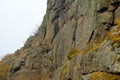 Boy rock climber climbs on a rock Royalty Free Stock Photo