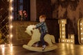 Boy on a rocking horse.