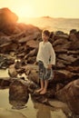 The boy on the rocks Royalty Free Stock Photo