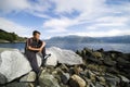 Boy on rocks near watrr Royalty Free Stock Photo