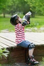 Boy on roller skates drinks water