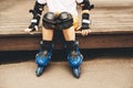 Boy roller skates protection sitting in park Royalty Free Stock Photo