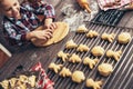 Child rolling out dough for christmas cookies