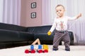 The boy in the room, playing with abandon. Royalty Free Stock Photo