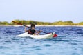 boy rowing in sea kayak Royalty Free Stock Photo