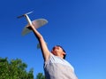 Boy running airplane model