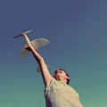 Boy running airplane model - vintage retro style