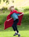 Boy Running Around in Red Towel Royalty Free Stock Photo