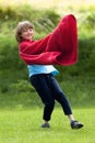 Boy Running Around in Red Towel Royalty Free Stock Photo