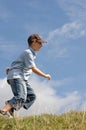 A boy running in grass Royalty Free Stock Photo