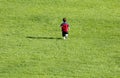 Boy-Running-Grass Royalty Free Stock Photo