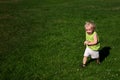Boy Running on Grass in Park Royalty Free Stock Photo