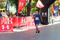 Boy running on half-marathon competition Royalty Free Stock Photo