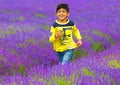 A boy running in Lavender farm in Banstead, Surrey, UK