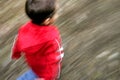 Boy running with motion blur Royalty Free Stock Photo